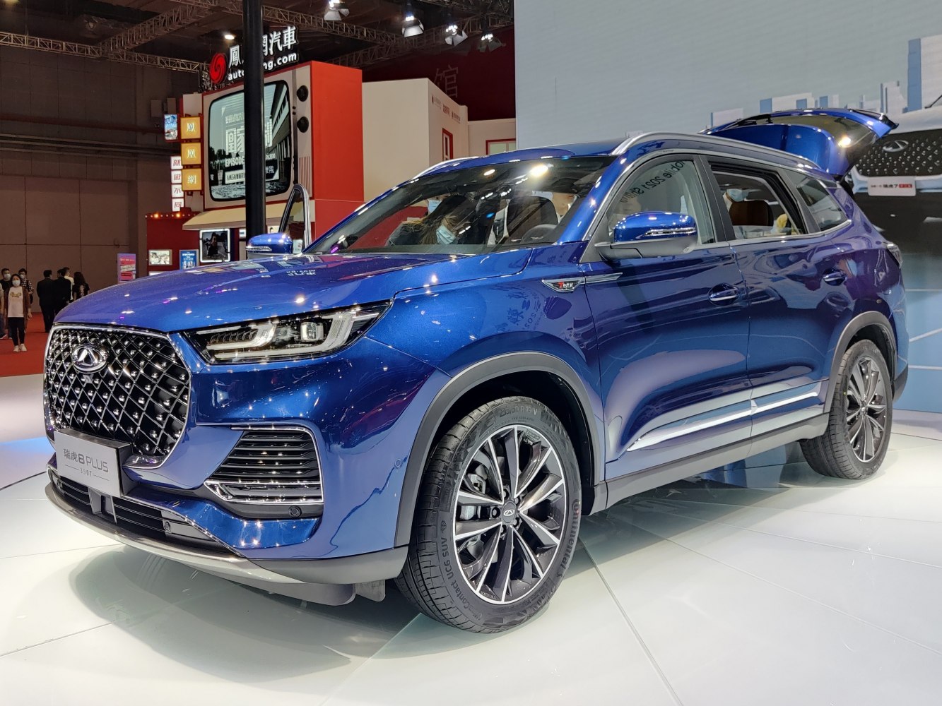 Large front grille with intricate mesh and LED headlight cluster