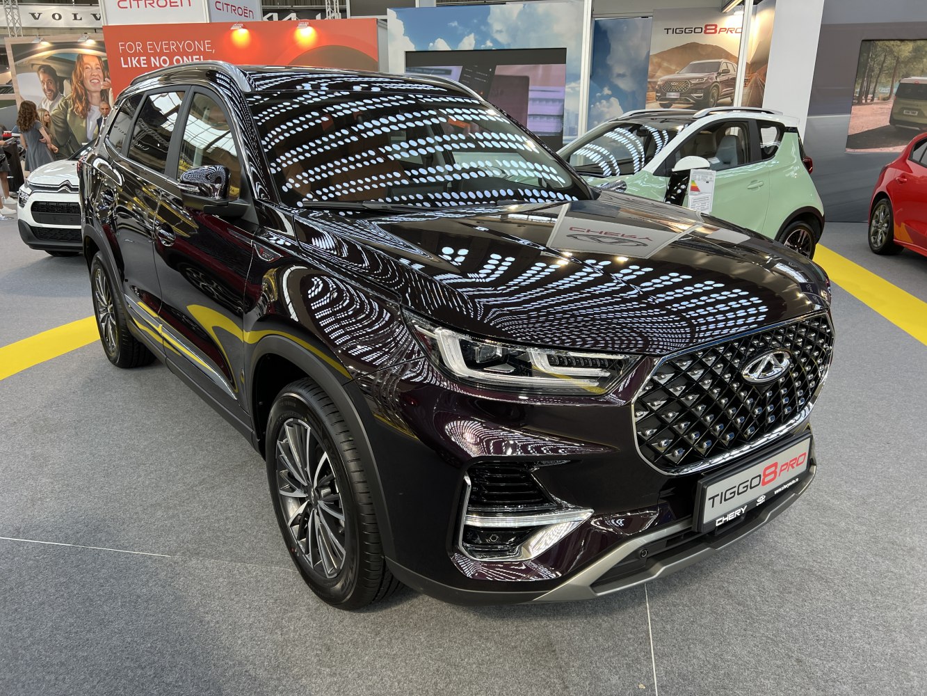 SUV front angle with LED headlights and diamond-pattern grille