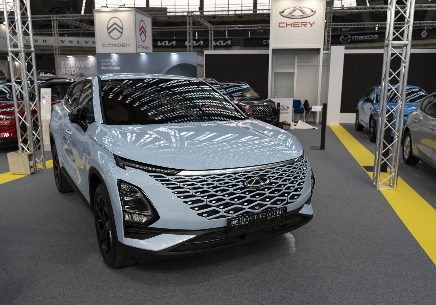 Front view with diamond-pattern grille and sleek headlights