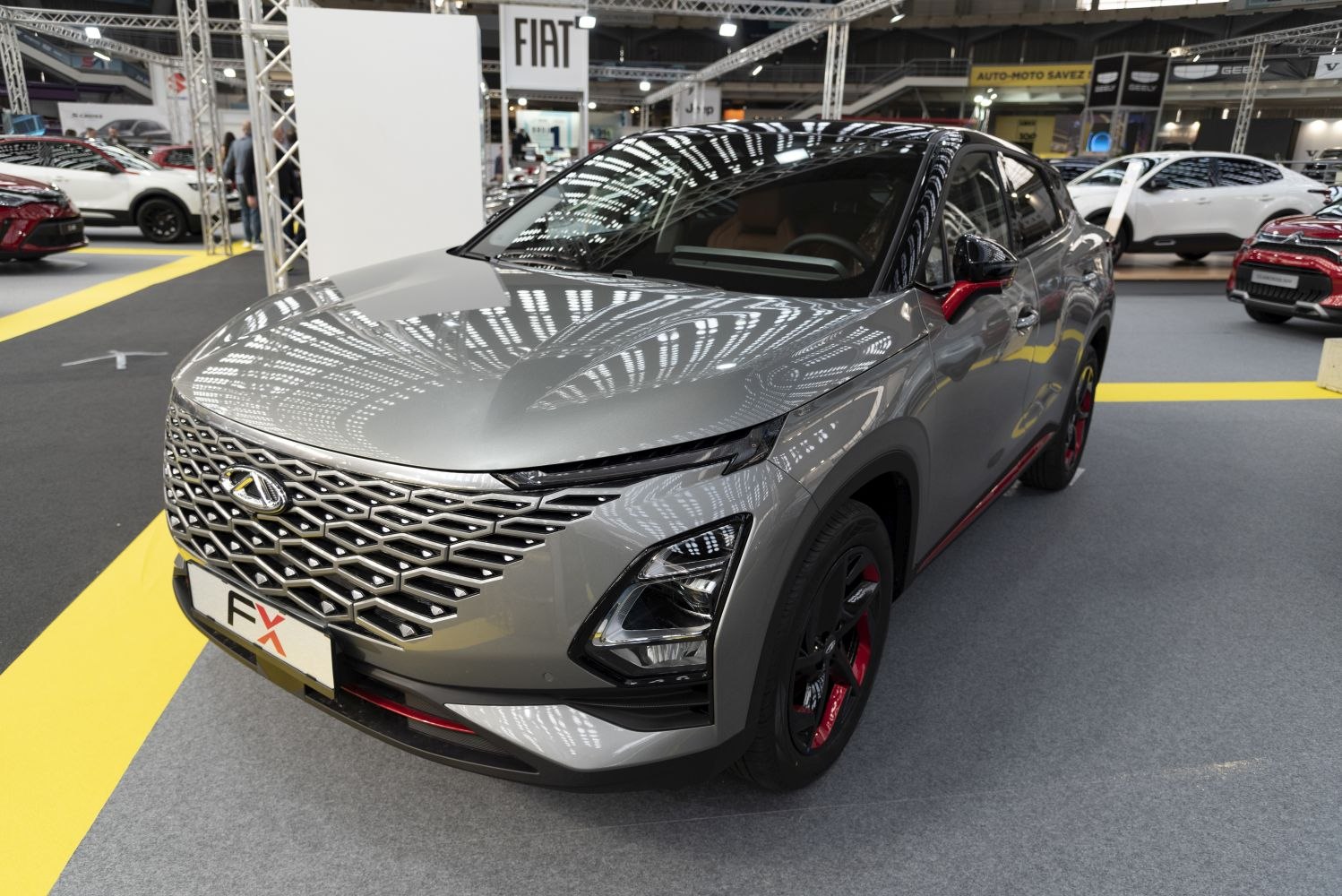 Front grille and advanced headlight design with red accents