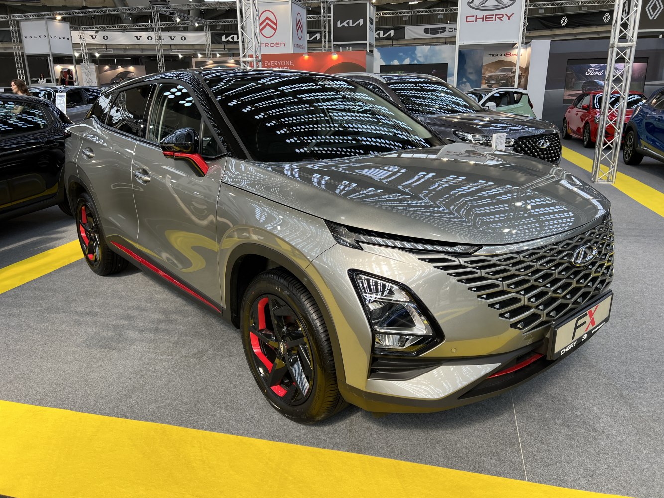 Distinctive front grille, LED headlights, red-accented wheels and trim.