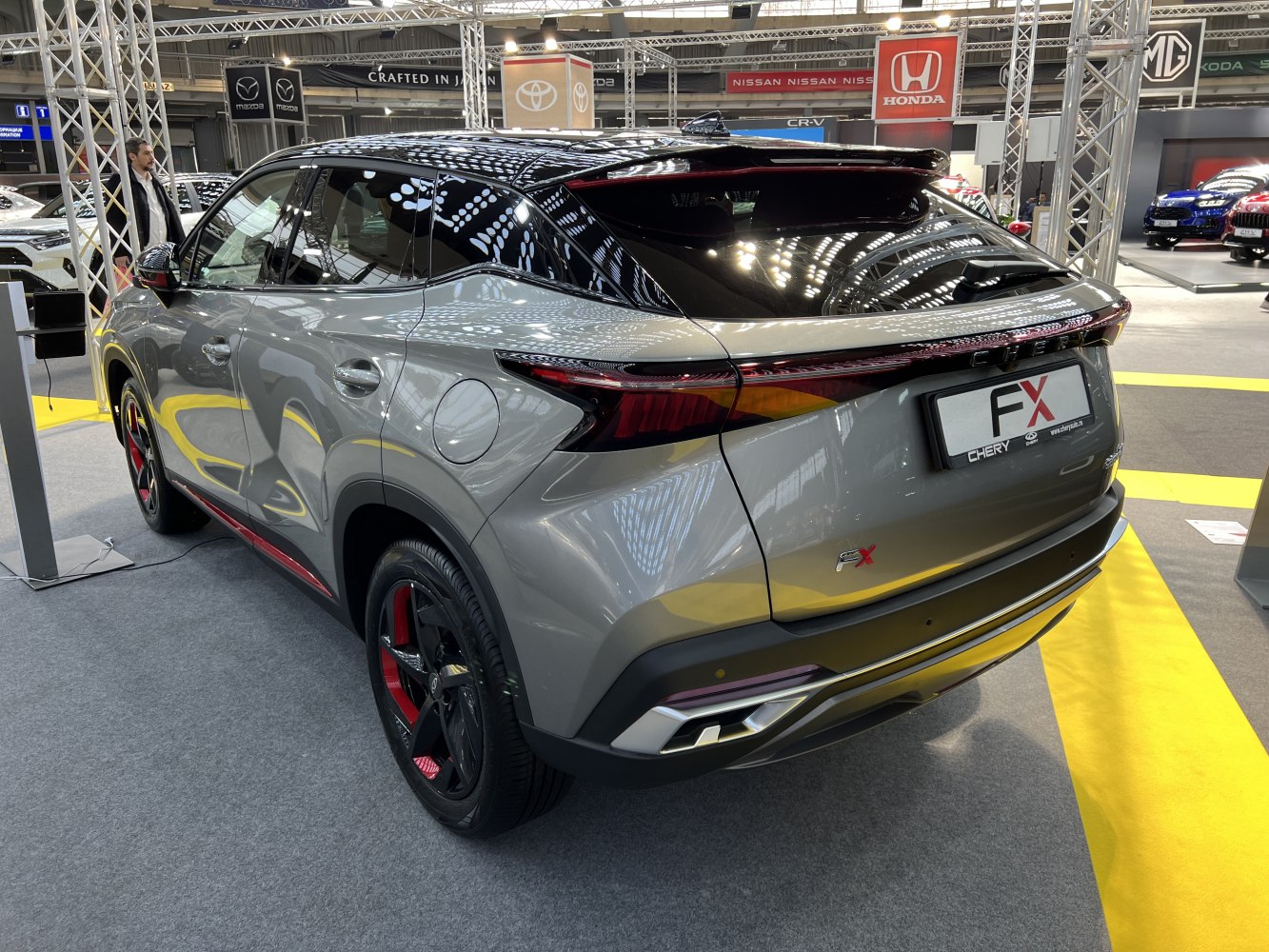 Rear view of SUV with sporty tail lights and black alloy wheels with red accents