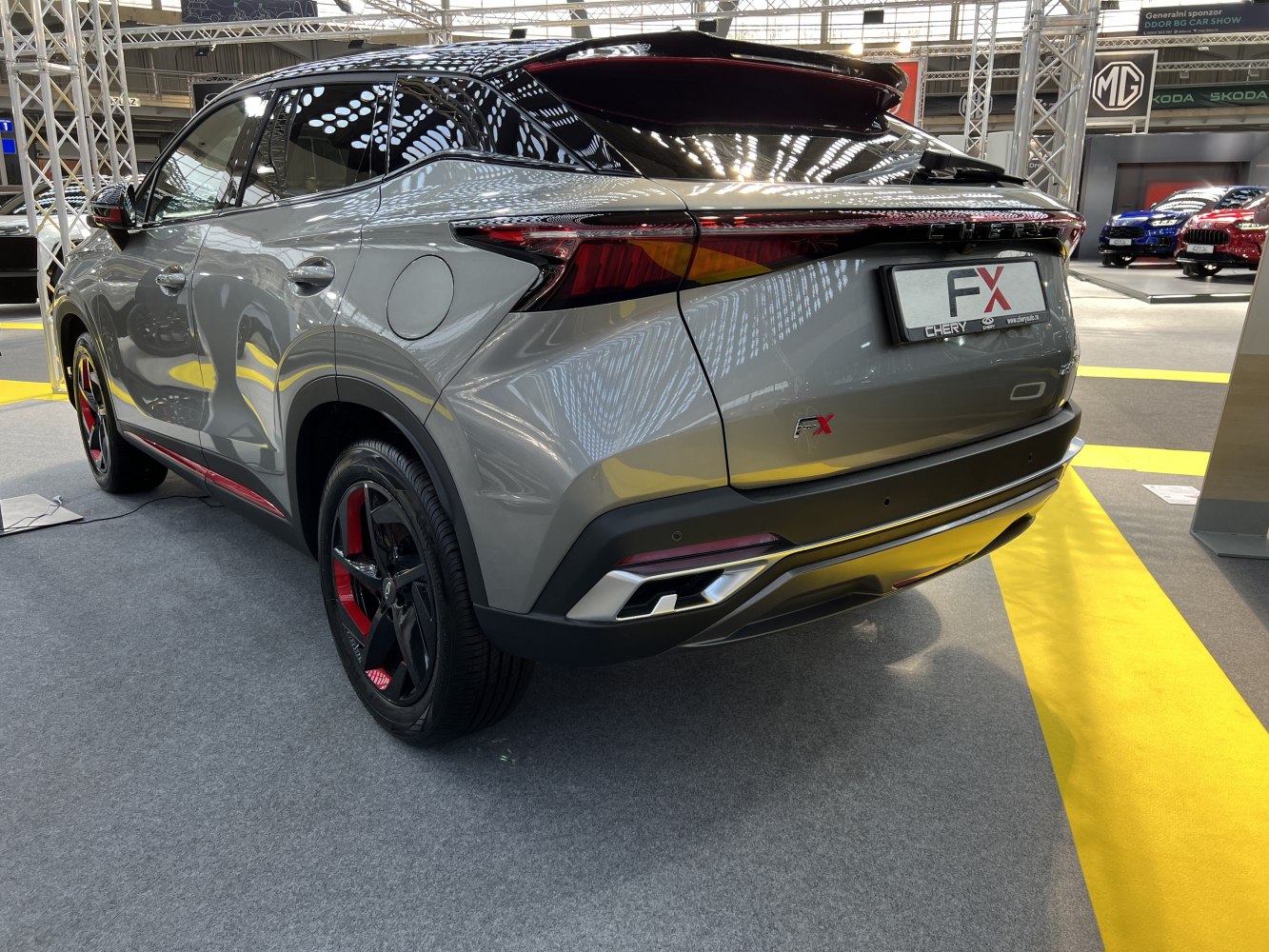 Rear side view with full-width LED tail lights and sporty wheels
