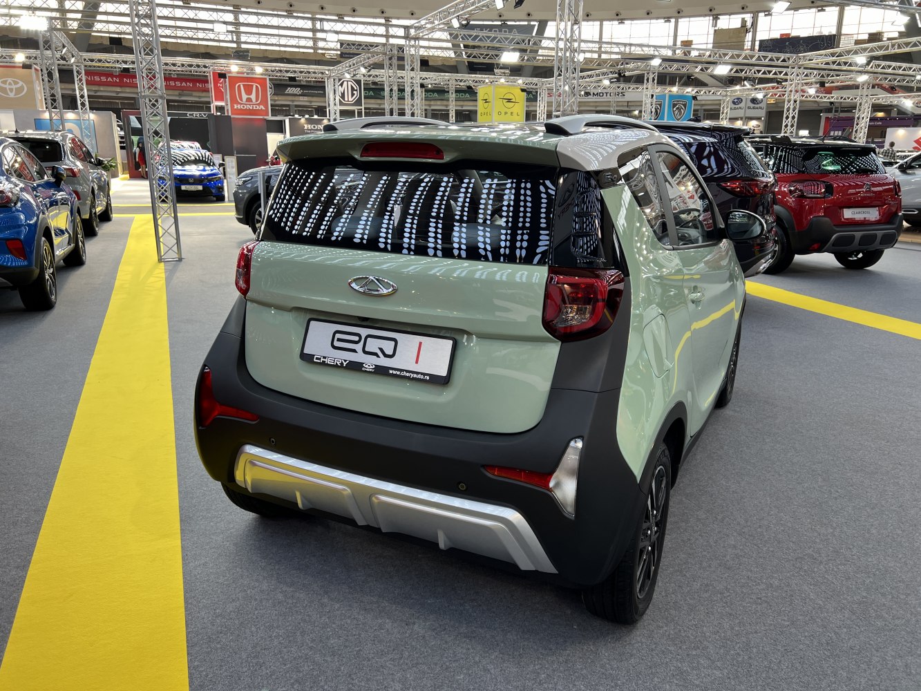 Compact electric car rear with distinctive tail lights and modern bumper