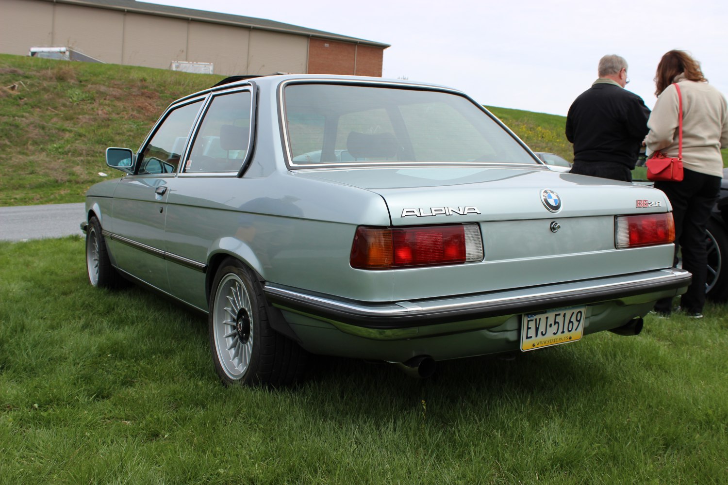 Rear-side view with classic tail lights and Alpina alloy wheels