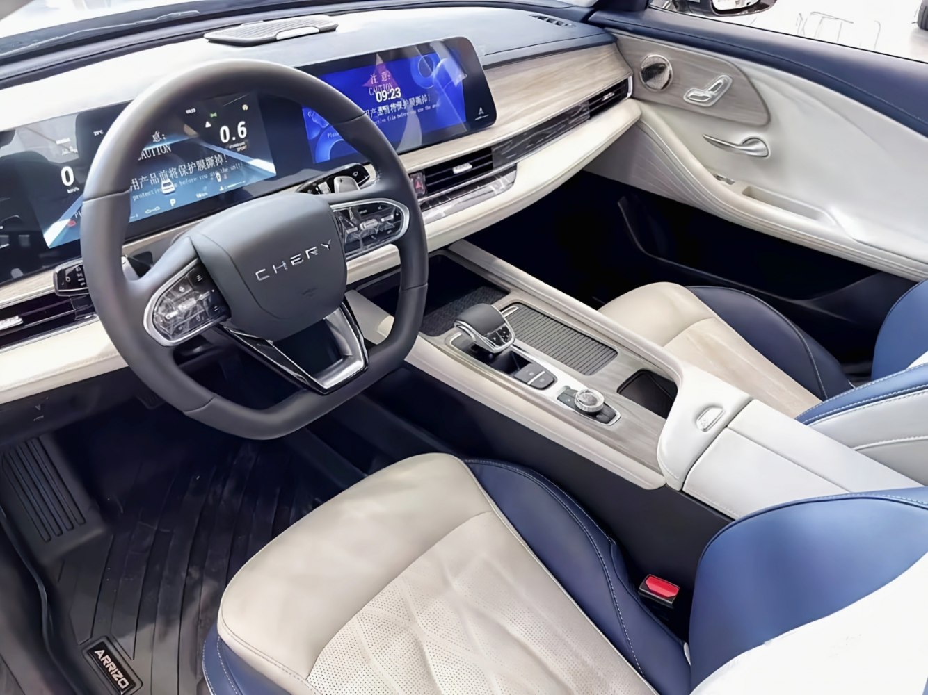 Modern digital dashboard, touchscreen, and stylish steering wheel design.