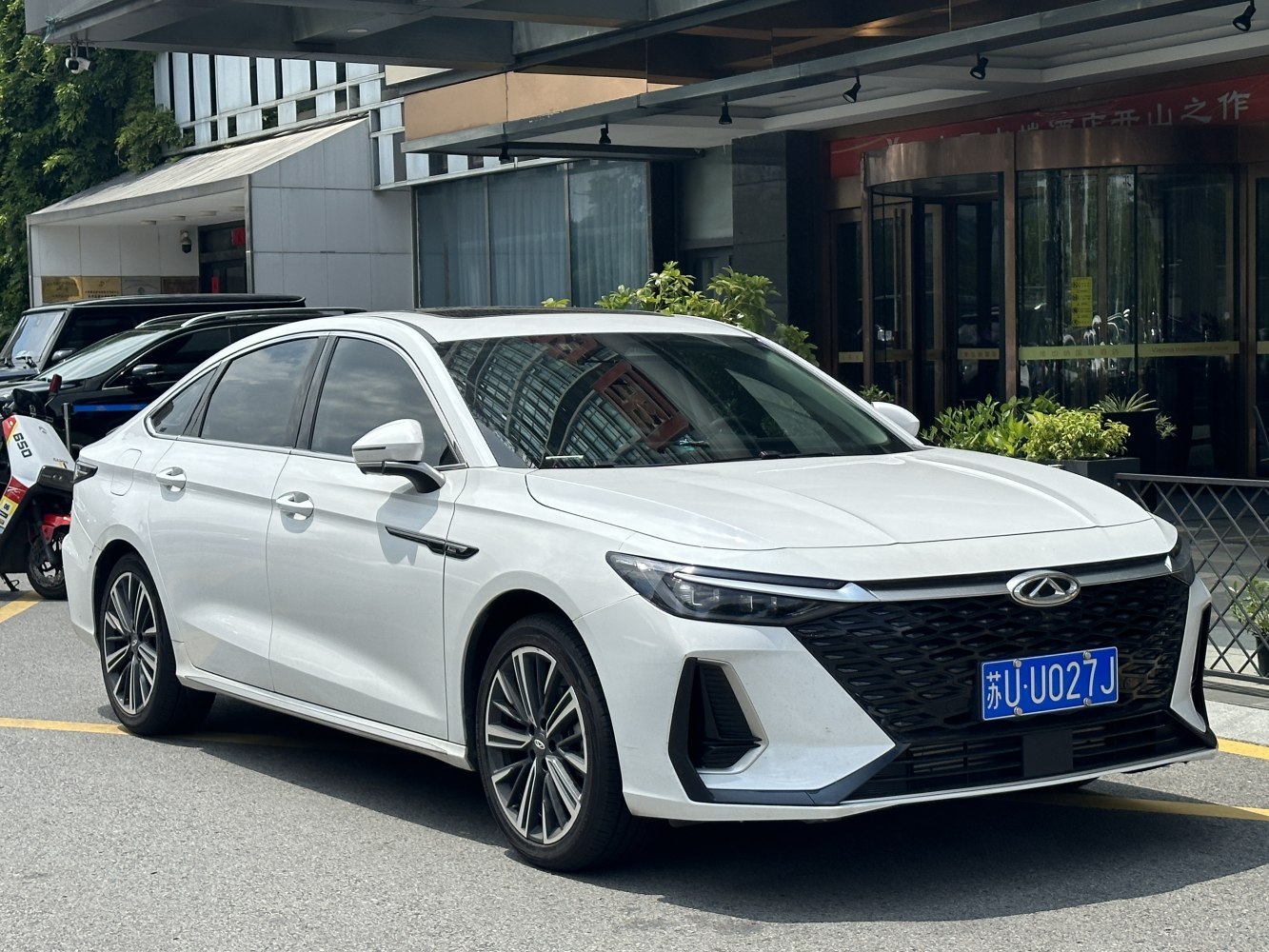 Front three-quarter view focusing on the headlights and alloy wheels.