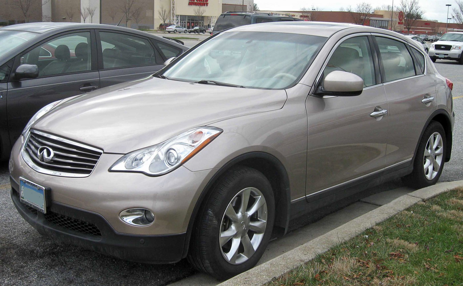 Silver SUV front side view with headlight and grille