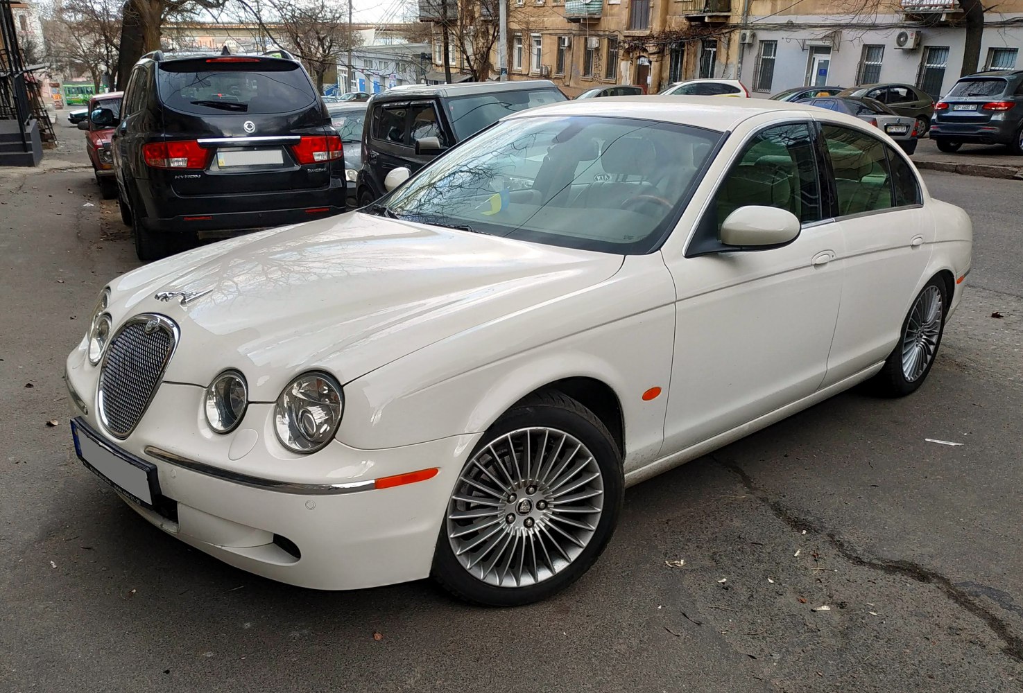 Classic luxury sedan with distinctive front grille and round headlights