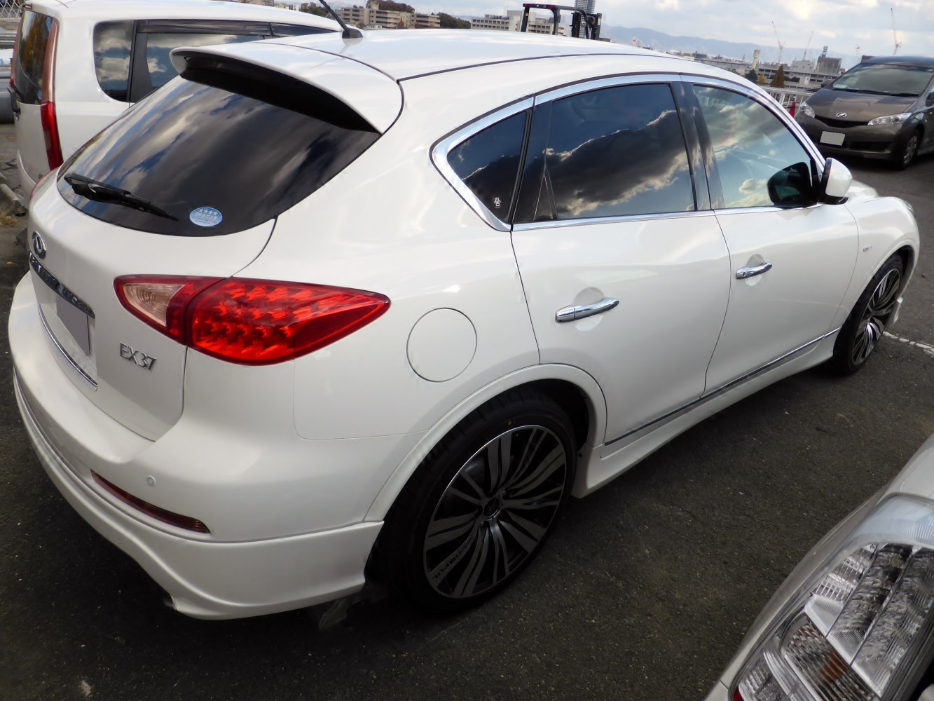 Rear and side view of SUV with black alloy wheels and tinted windows