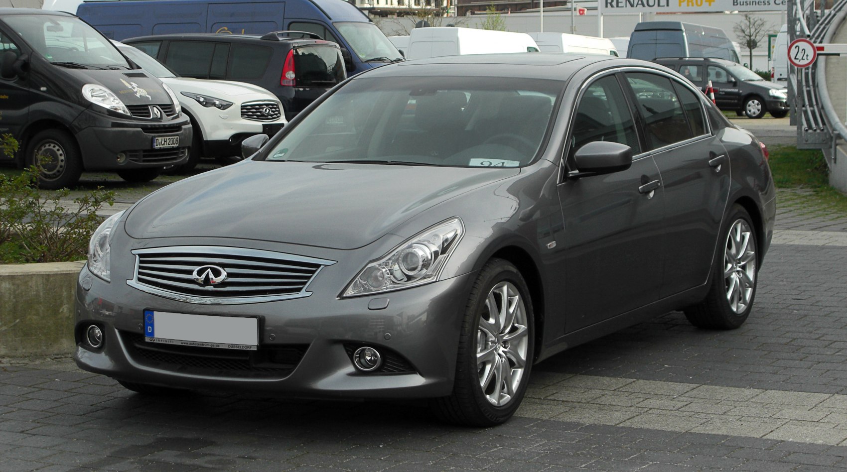 Sporty luxury sedan front with LED headlights and alloy wheels