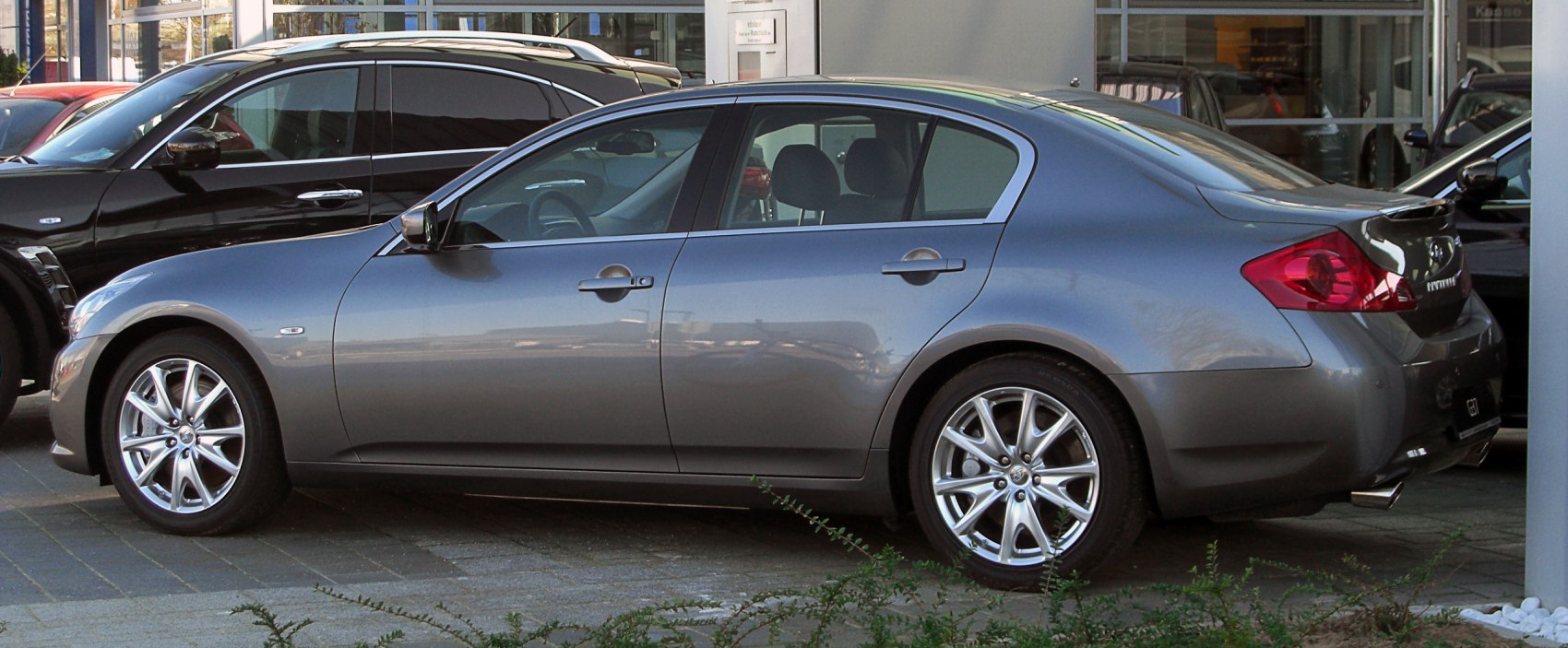 Side view of a sedan with alloy wheels and tinted windows