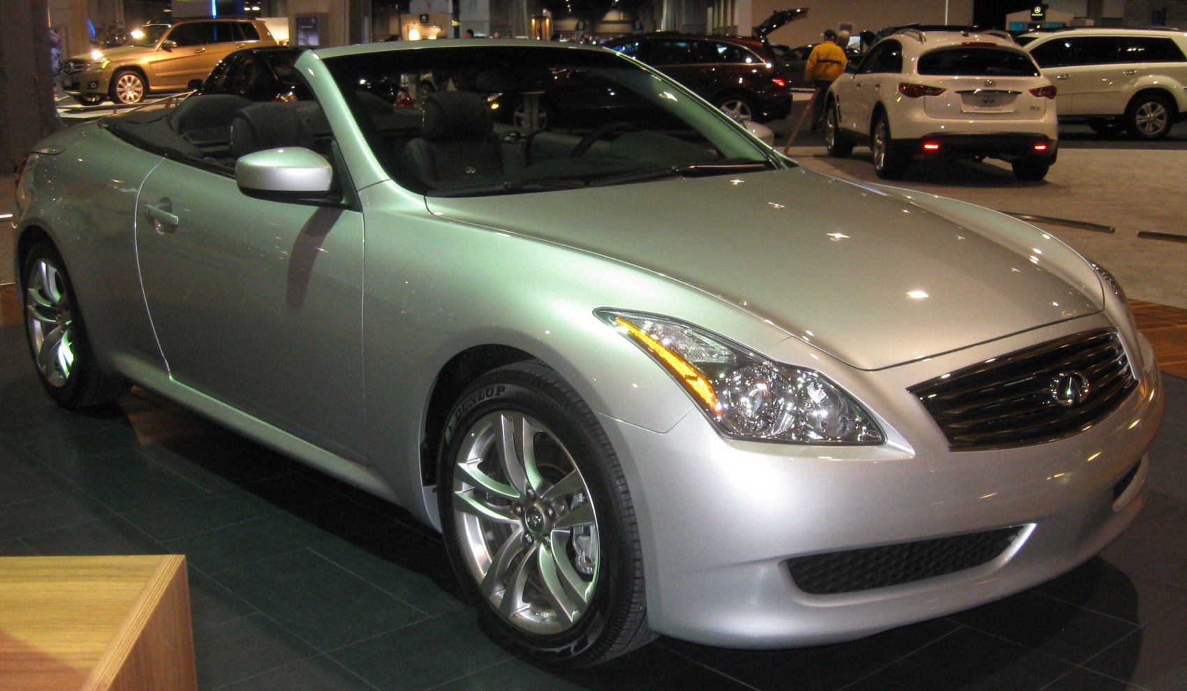 Silver convertible sport coupe with aerodynamic design and alloy wheels