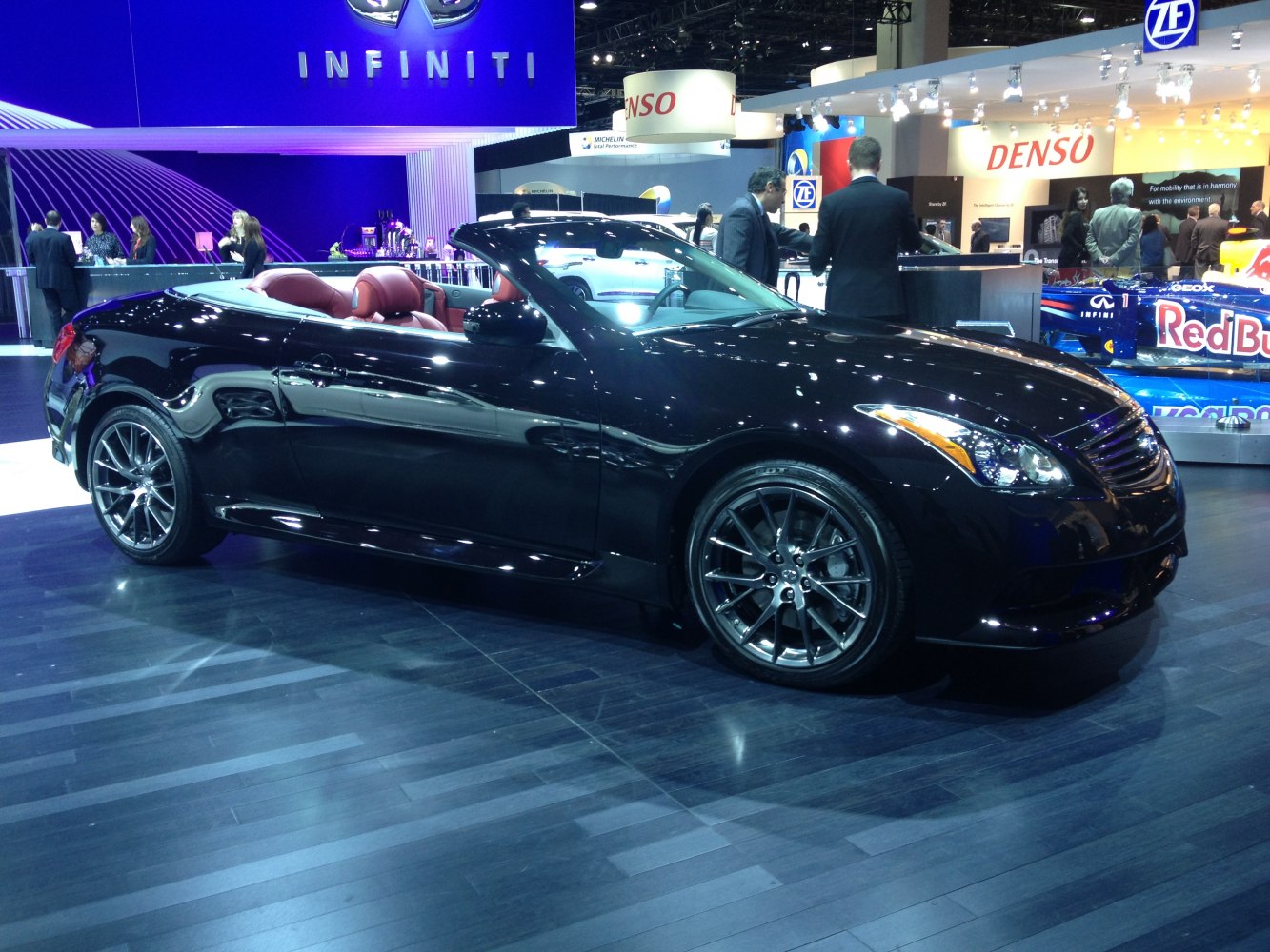 Black sports convertible with alloy wheels and open roof