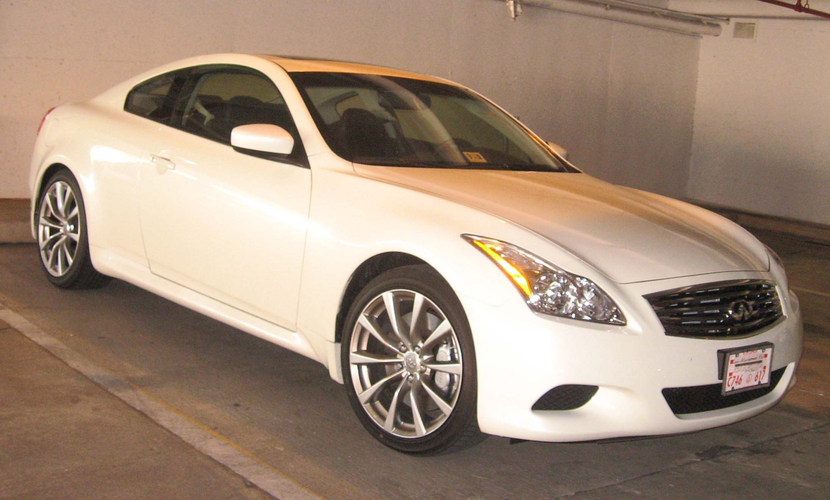 Two-door coupe front side view with alloy wheels