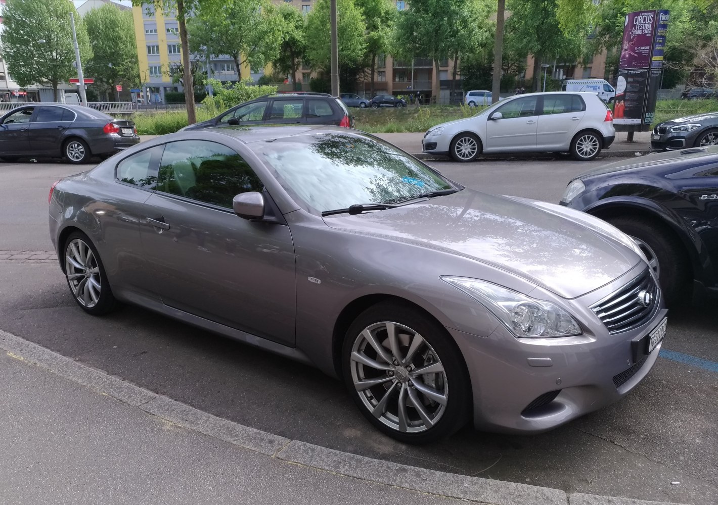 Silver sports coupe with alloy wheels and smooth aerodynamic styling