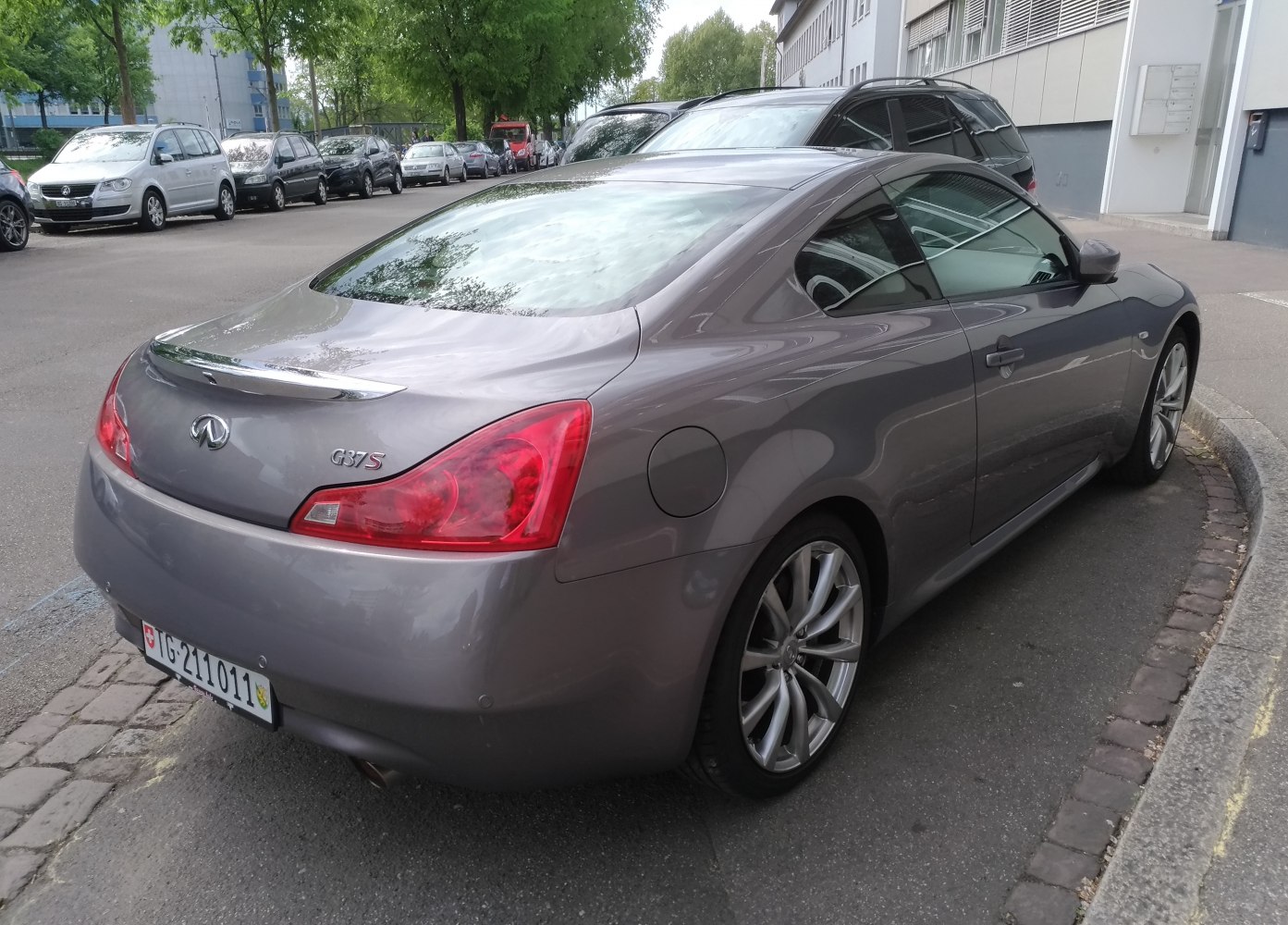 High-angle rear and side view of a sleek coupe with distinctive tail lights