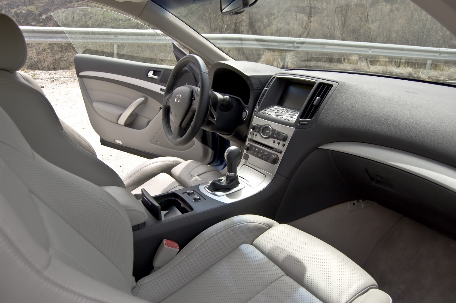 Luxury car interior with dashboard, steering wheel, center console