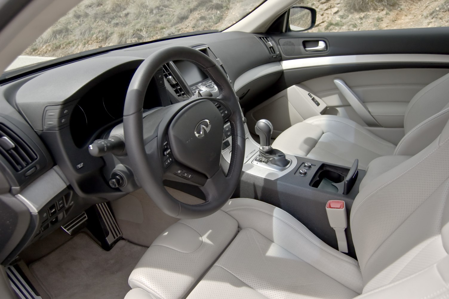 luxurious steering wheel and center console in light interior