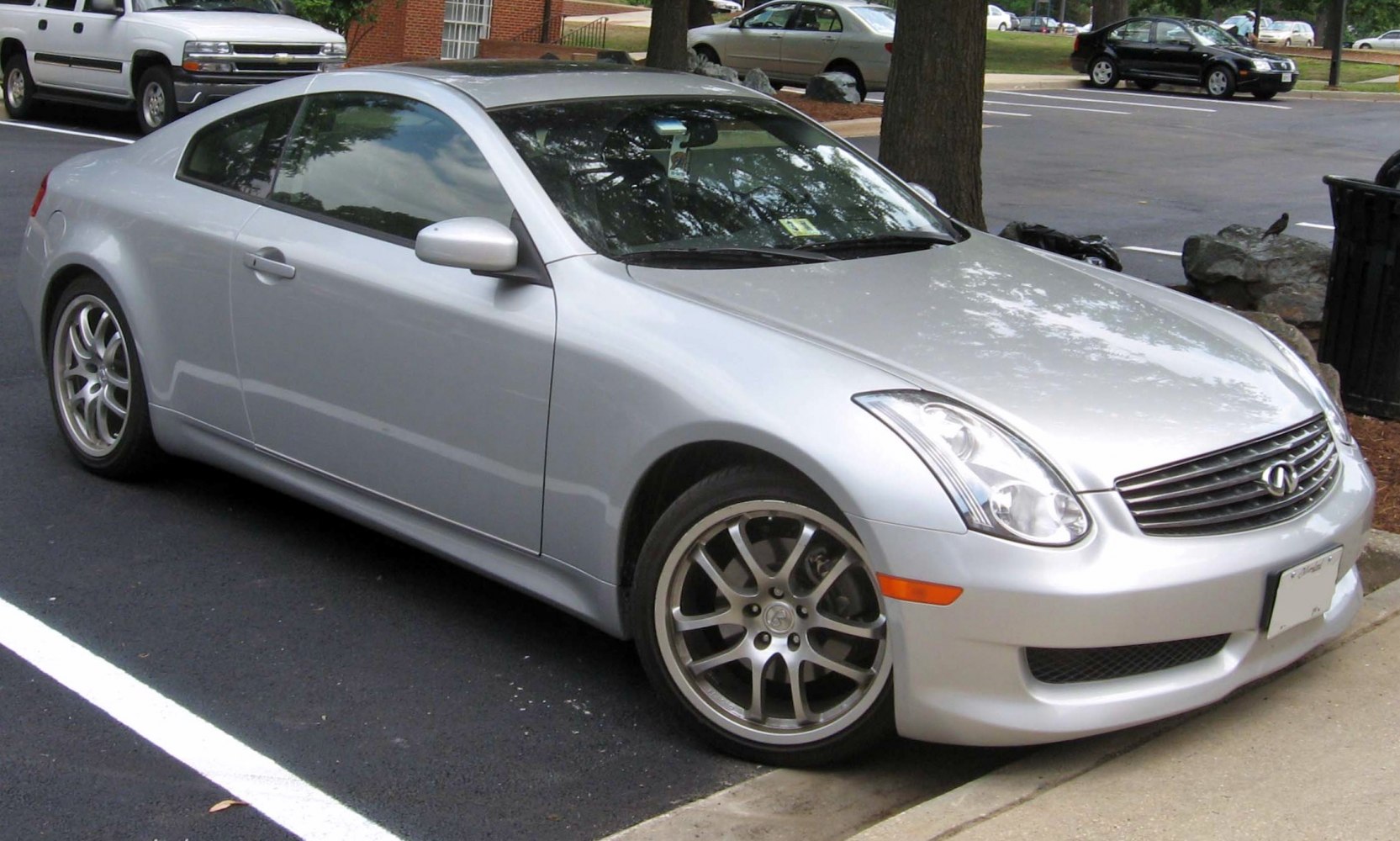 Silver coupe with alloy wheels and sporty front side design