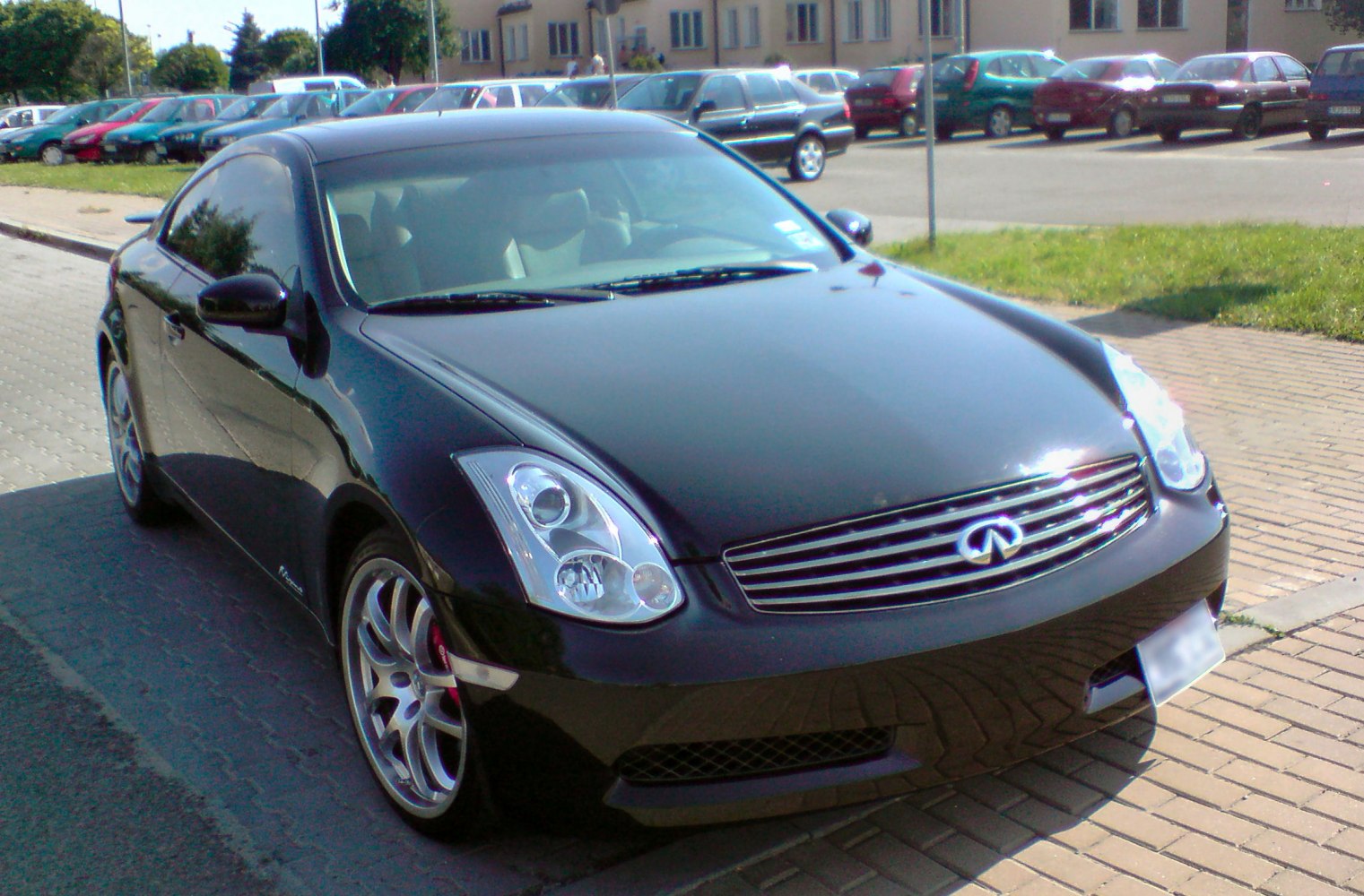 Front view of 2003 coupe with chrome grille and alloy wheels