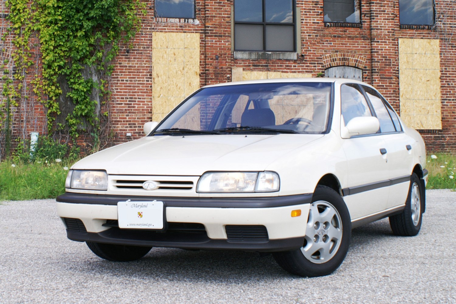 Front three-quarter view with rectangular headlights and clean grille