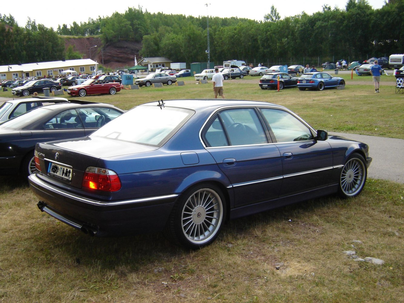 Luxury sedan with multi-spoke alloy wheels and sleek profile