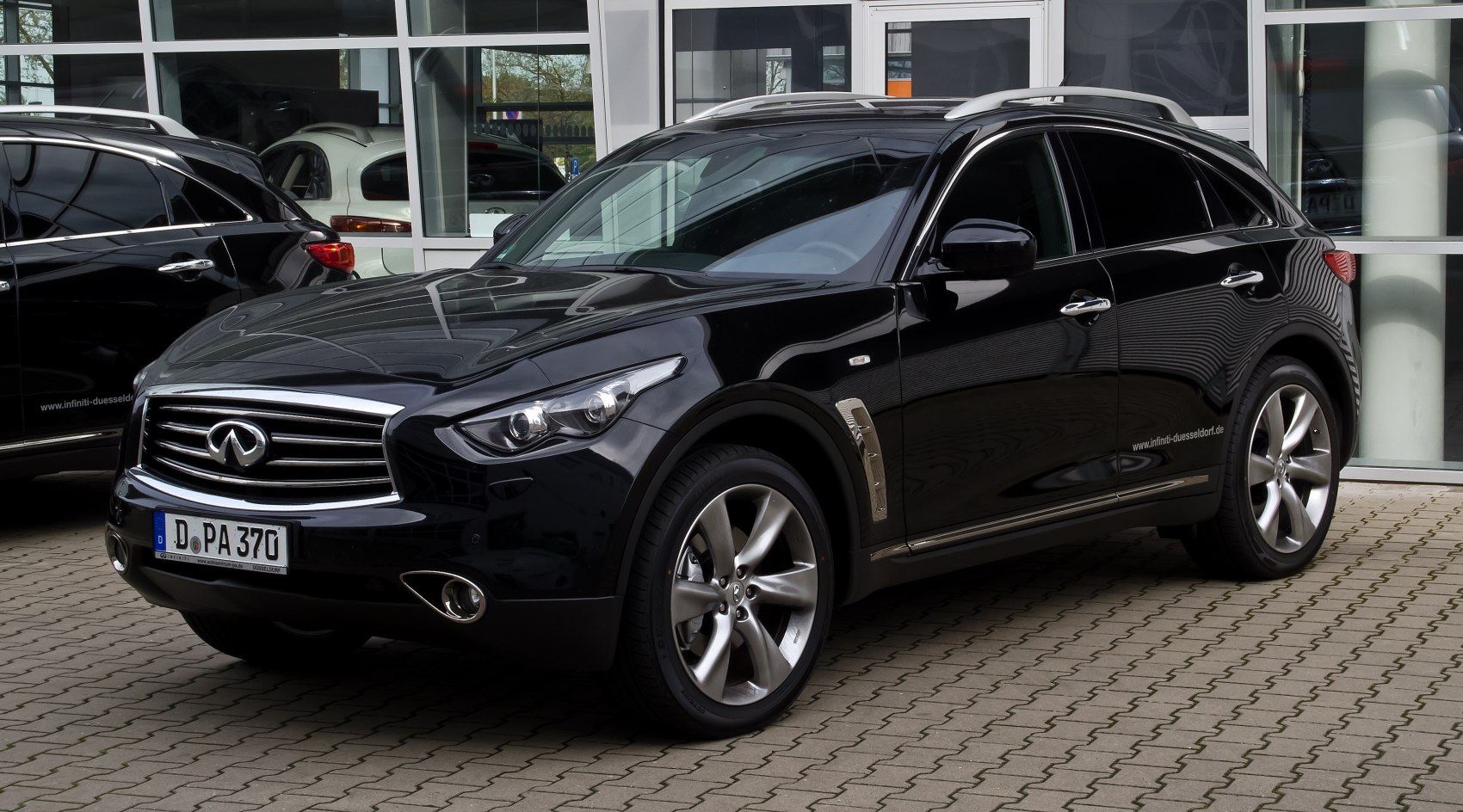 Front and side view of a black luxury SUV with alloy wheels and sleek design