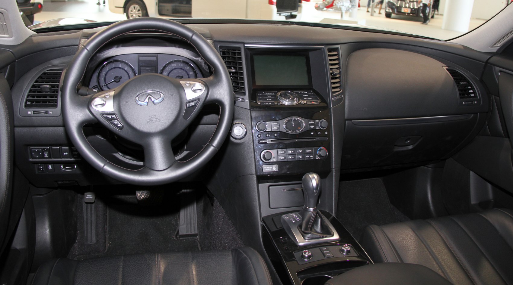 Interior dashboard, steering wheel, and gear shift close-up