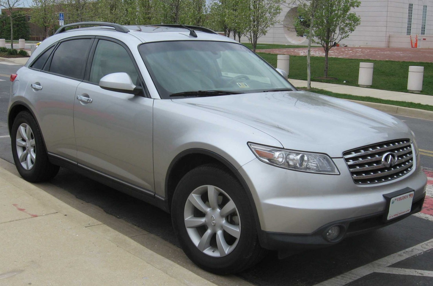 Silver SUV front side view with roof rails and distinctive grille