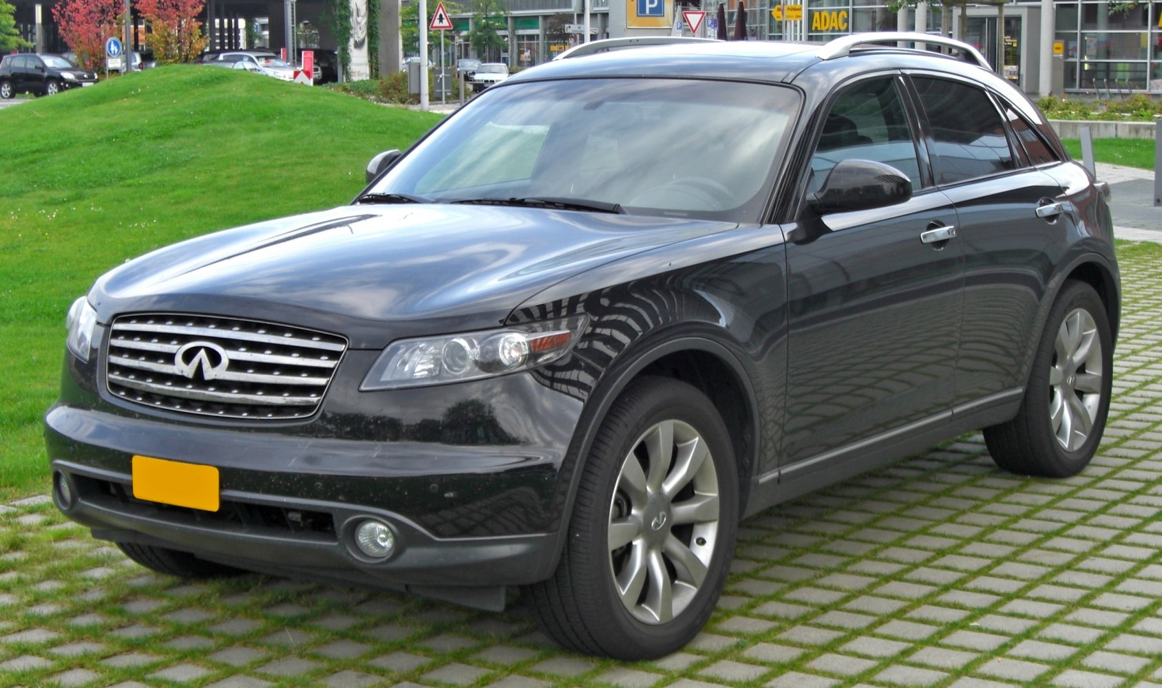 Front and side view showing grille, headlights, alloy wheels