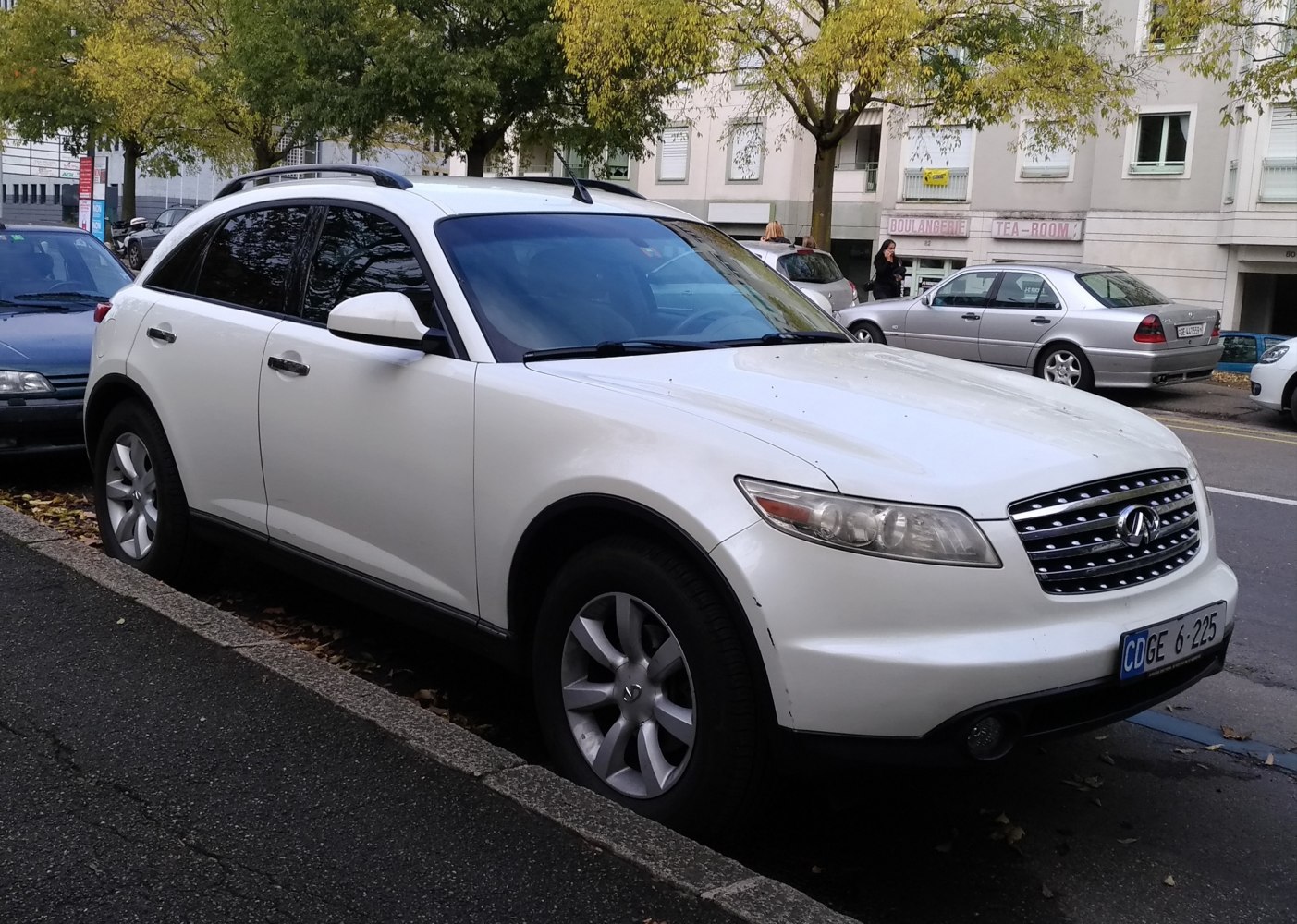 White compact luxury SUV front and side with alloy wheels and grille