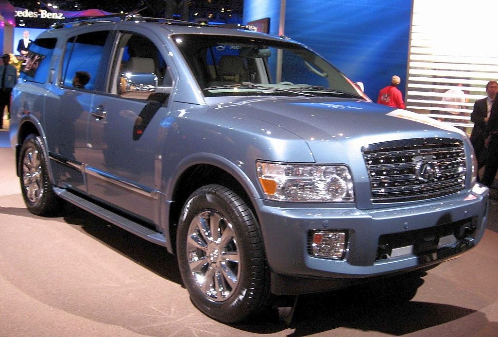 Front view of large SUV with chrome grille and wheels
