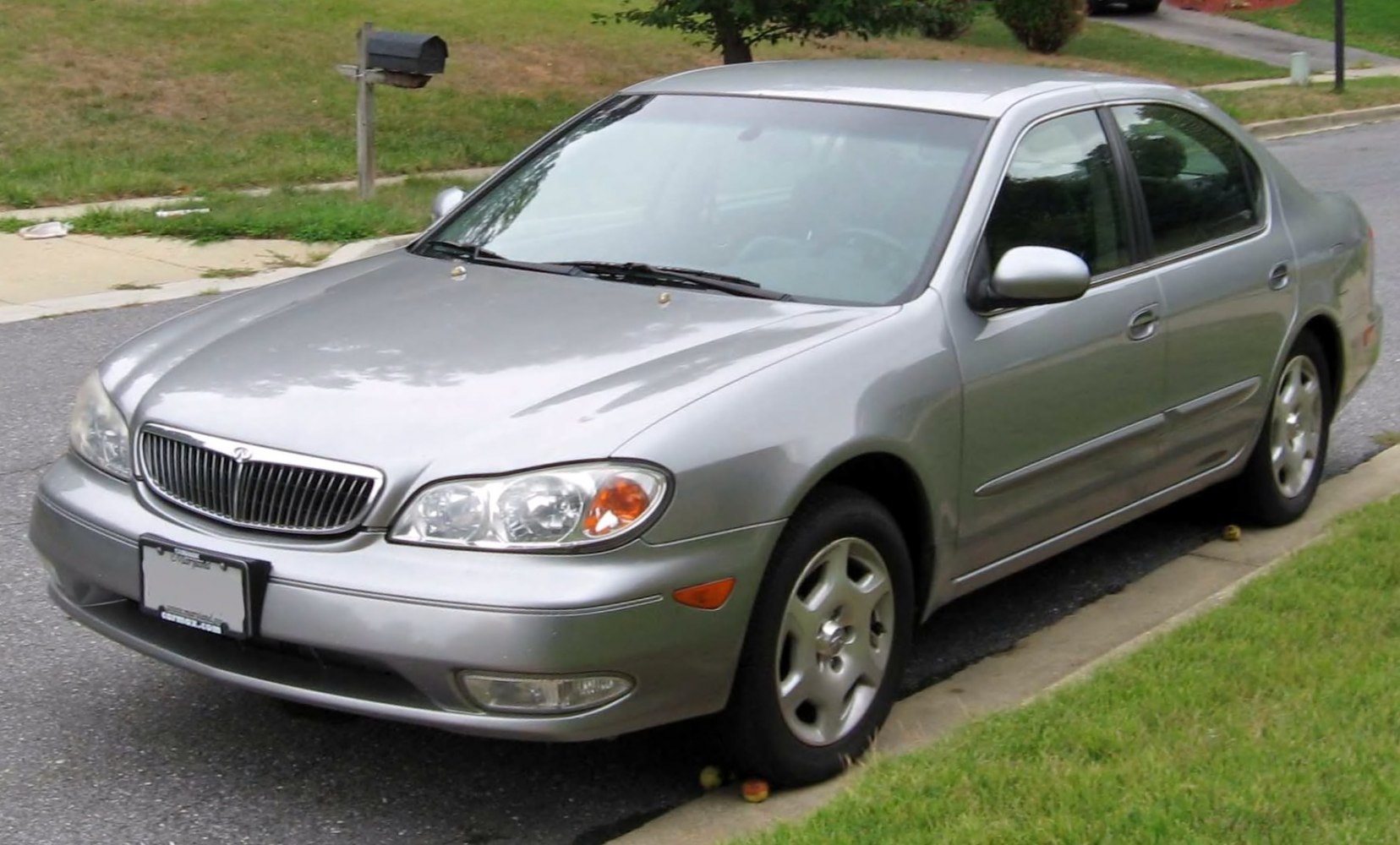 Silver mid-size sedan, chrome grille, alloy wheels