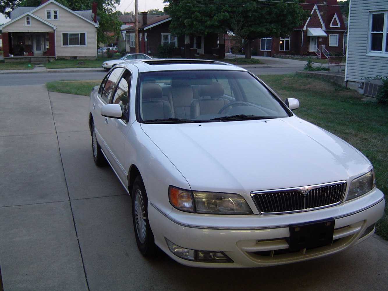 Classic sedan front view with sunroof and prominent grille