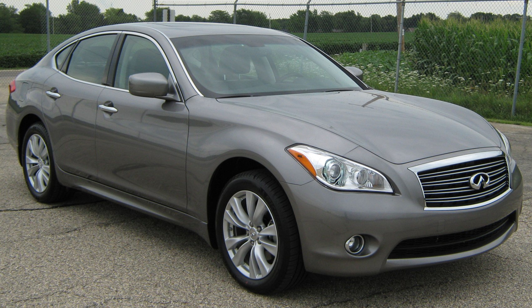 Front side exterior with grille and alloy wheels of a sedan.