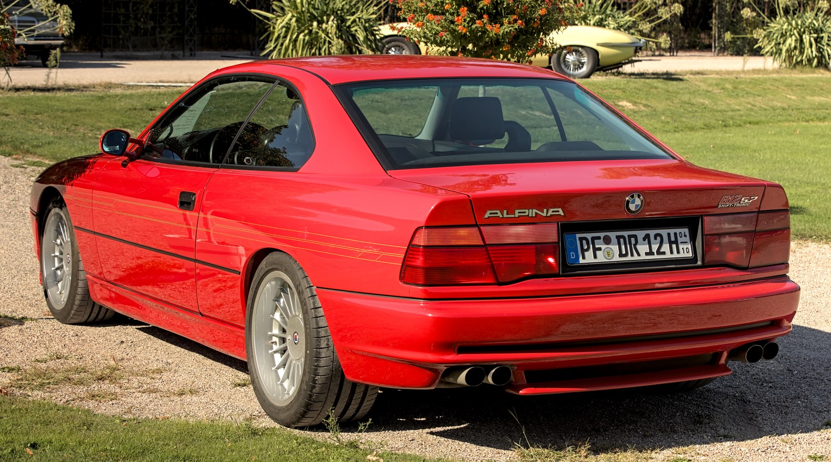 Red coupe rear view with quad exhaust and ALPINA wheels