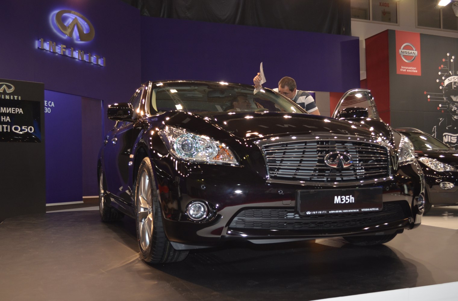 Black sedan with prominent front grille and headlights