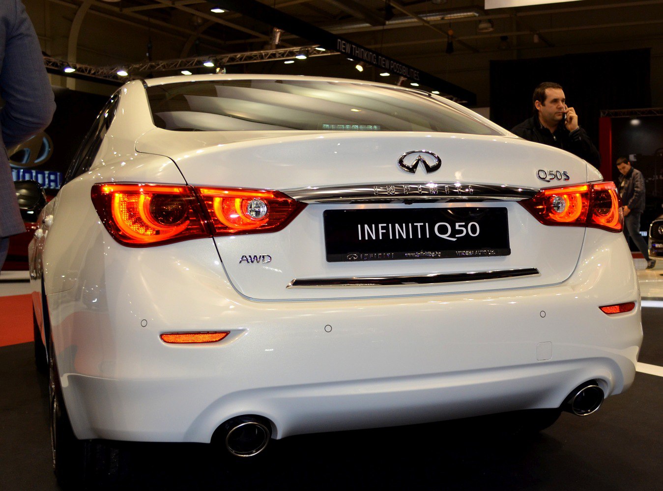 Rear view with LED tail lights, AWD badge, dual exhaust tips