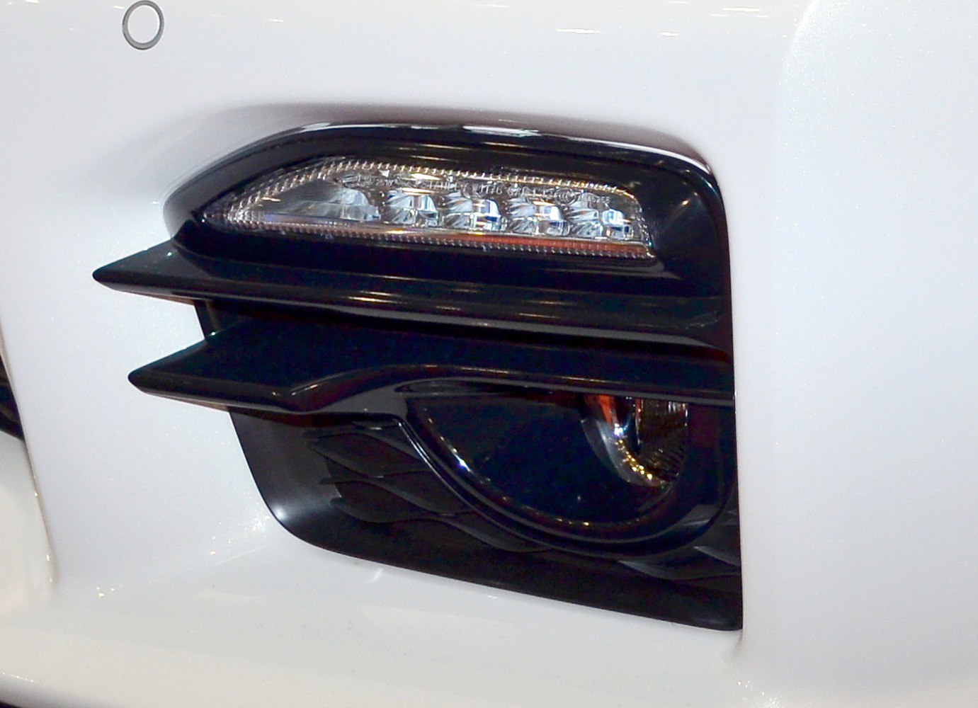 Fog light and LED indicator close-up on front bumper