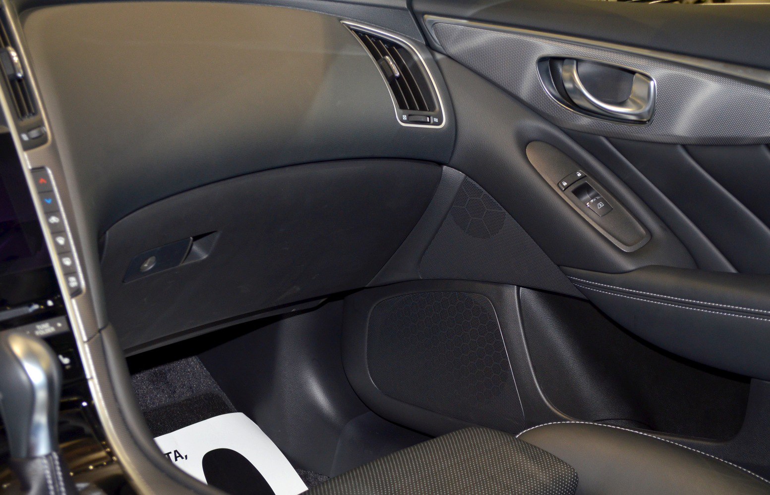 Passenger side door panel, air vent, glove compartment, and window controls