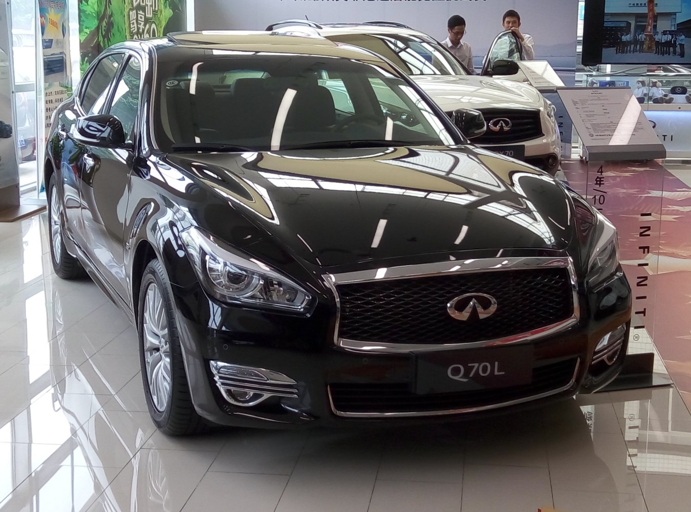 Front view of luxury sedan with mesh grille and LED headlights