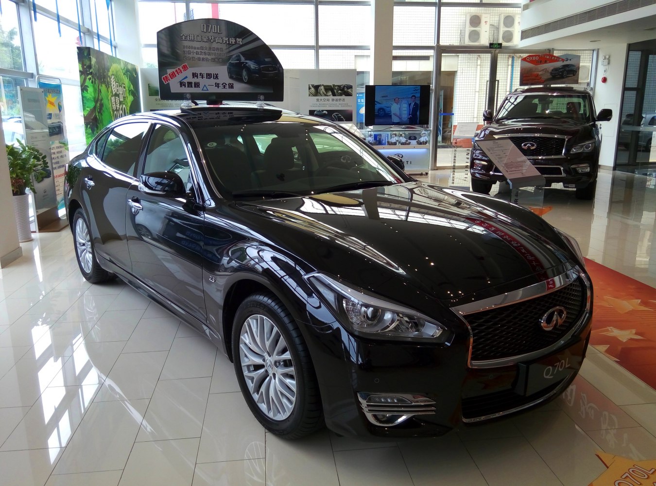Black luxury sedan front with detailed headlights and chrome grille