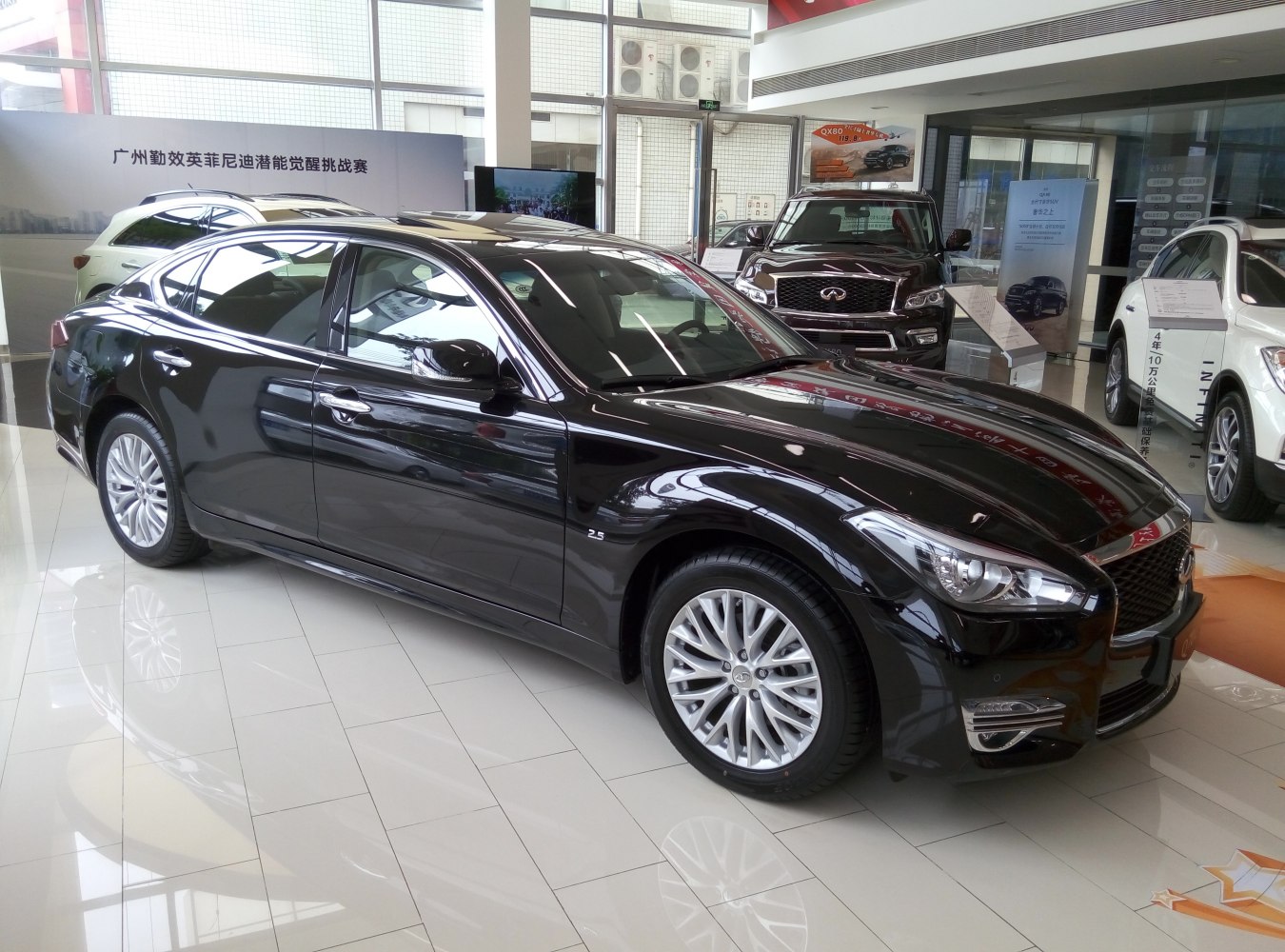 Luxury sedan with modern headlights and intricate alloy wheels