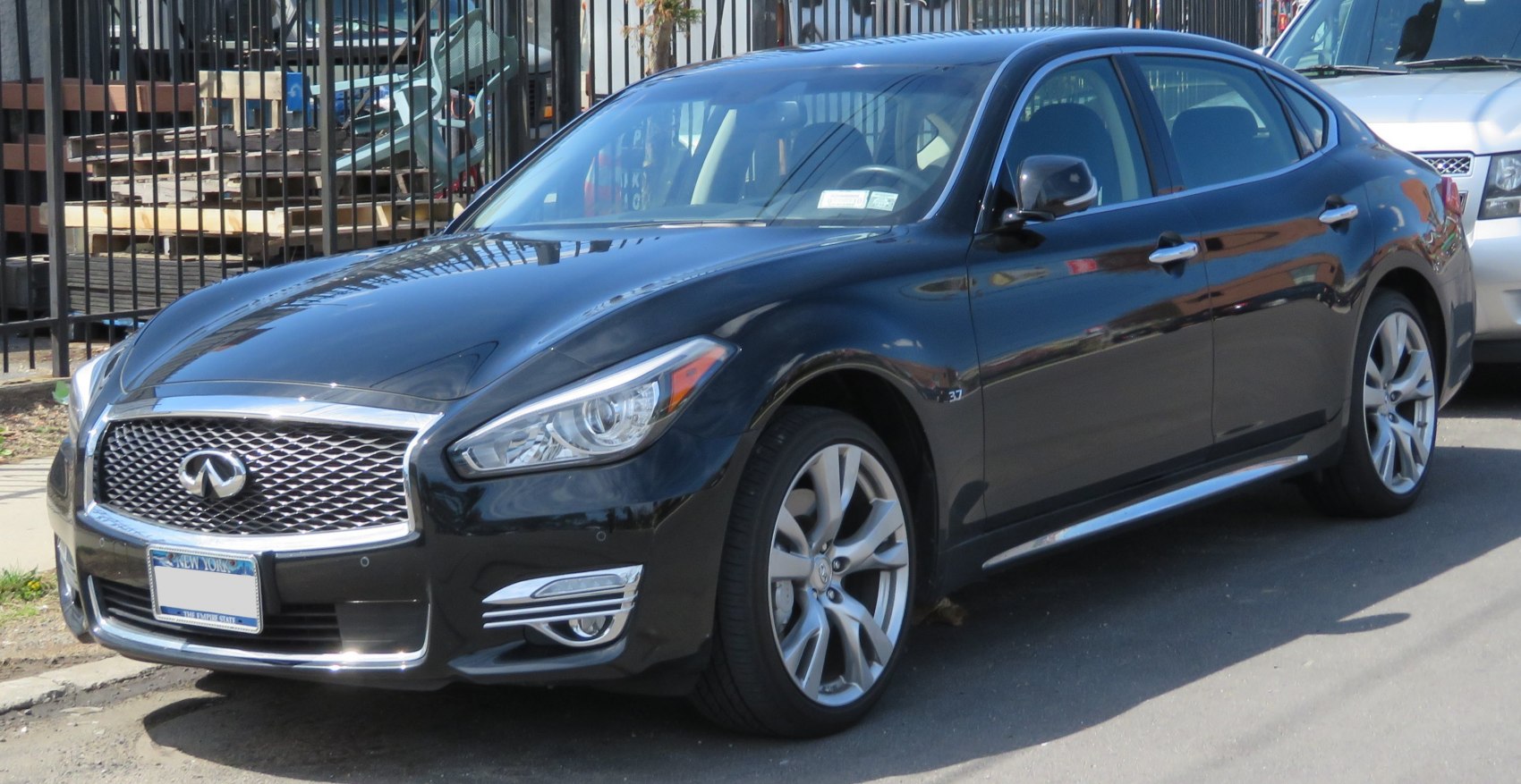 Front side view of luxury sedan with alloy wheels and sleek design