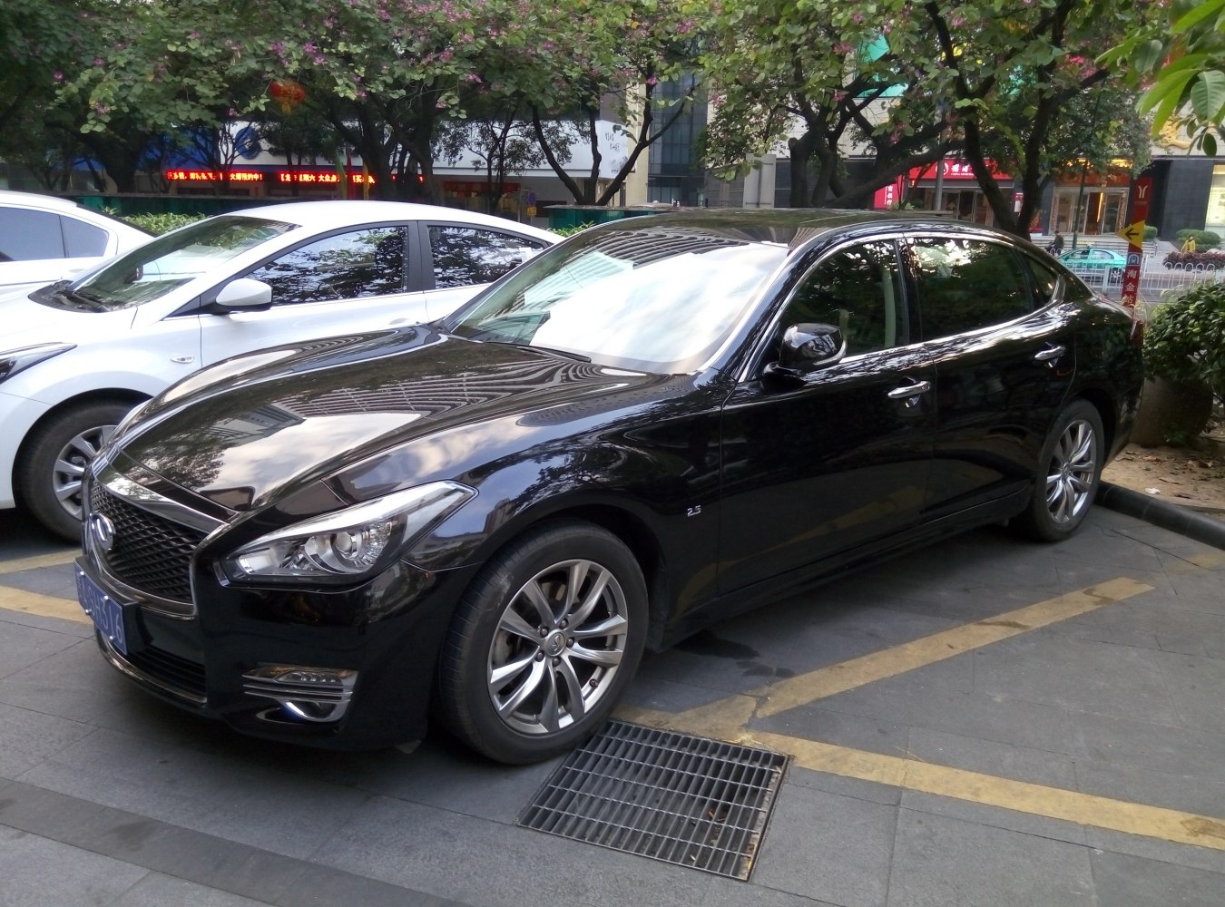 Black luxury sedan with extended wheelbase and modern headlights