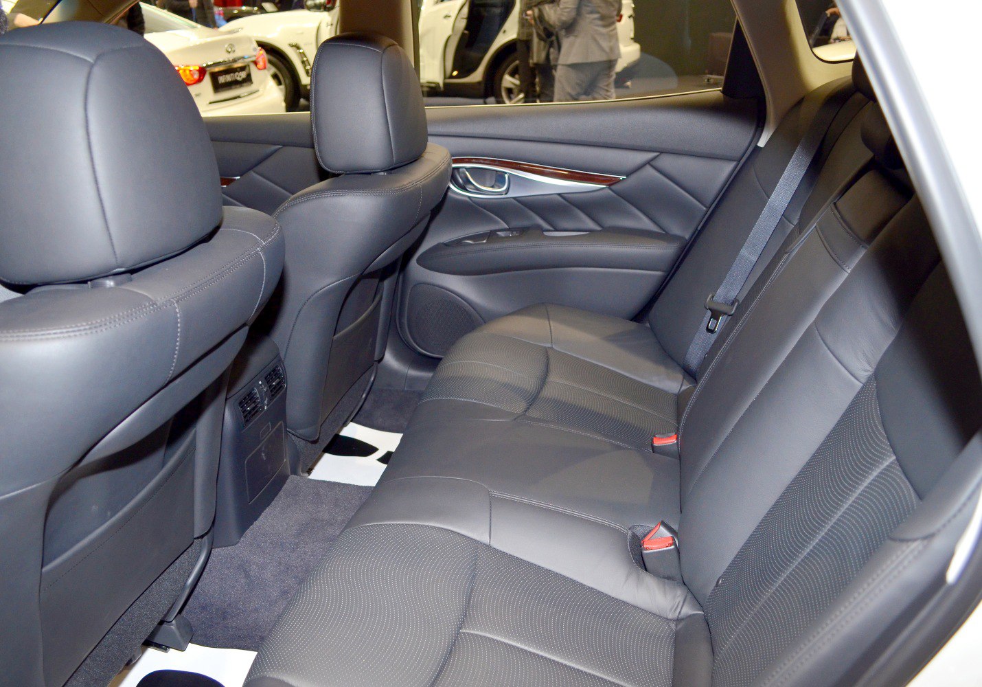 Luxury leather rear seats and elegant door panel with wood trim