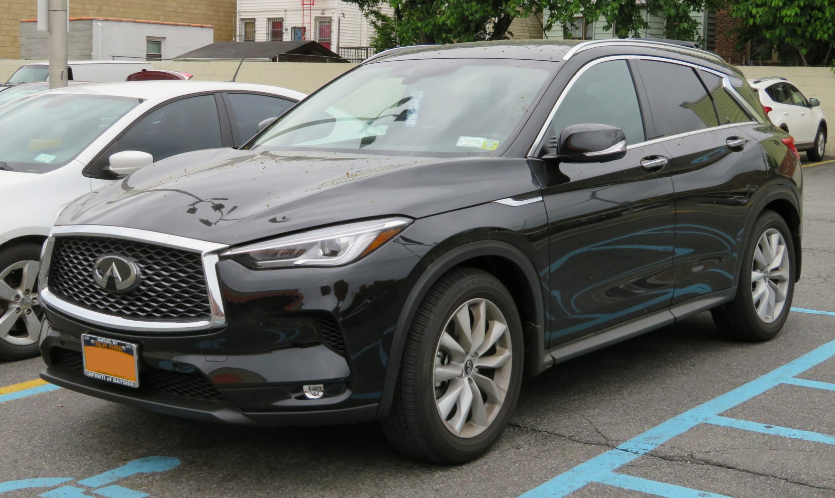 Luxury SUV with bold grille, sharp headlights, and alloy wheels