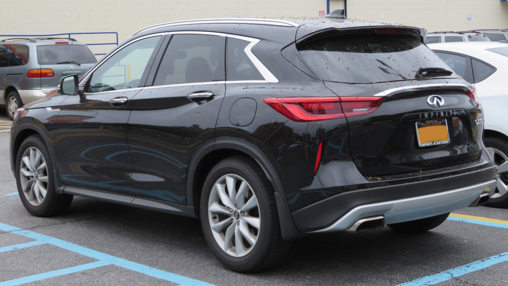 Rear and side profile of modern SUV with sleek taillights and alloy wheels