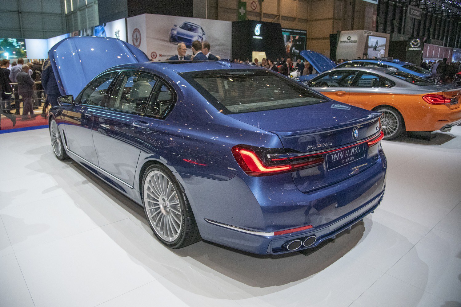 Rear and side view showcasing quad exhaust and multi-spoke wheels